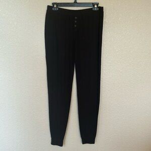 Women’s joggers in black, size medium.